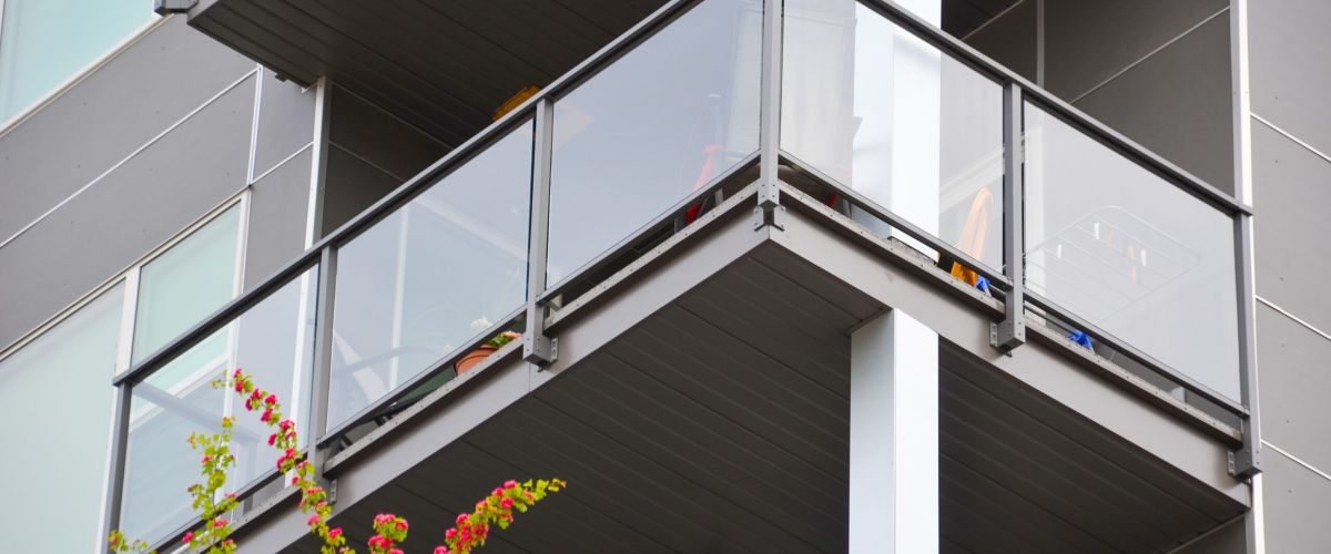 Glass Railing with top bar and facia mount by DekSmart