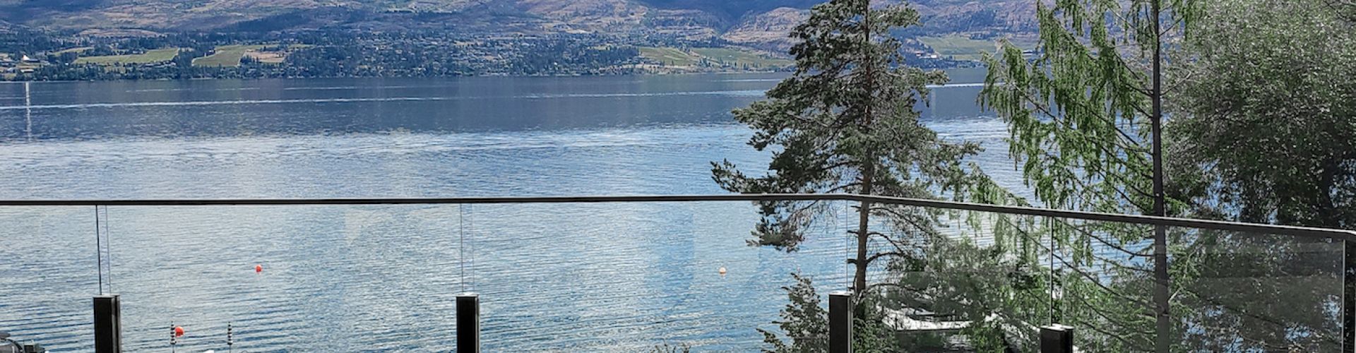 Durable railing kit with 5mm glass panels/powder coated black aluminum.