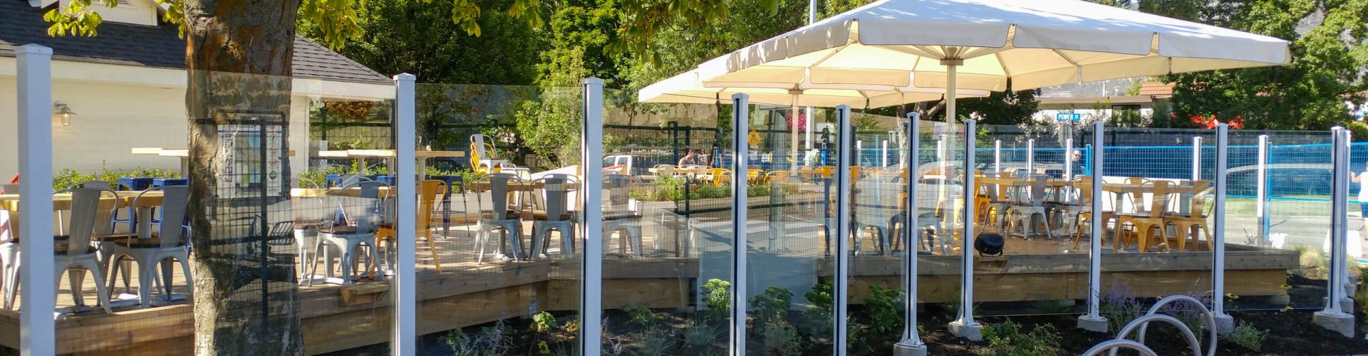 Topless aluminum & glass rail on concrete mount by DekSmart railings manufacturer