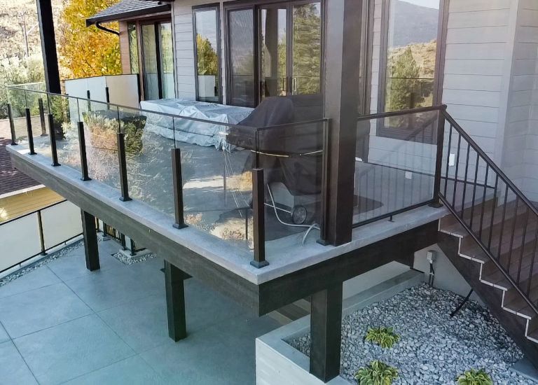 Stairs w/ black aluminum picket railings/glass railings by DekSmart.