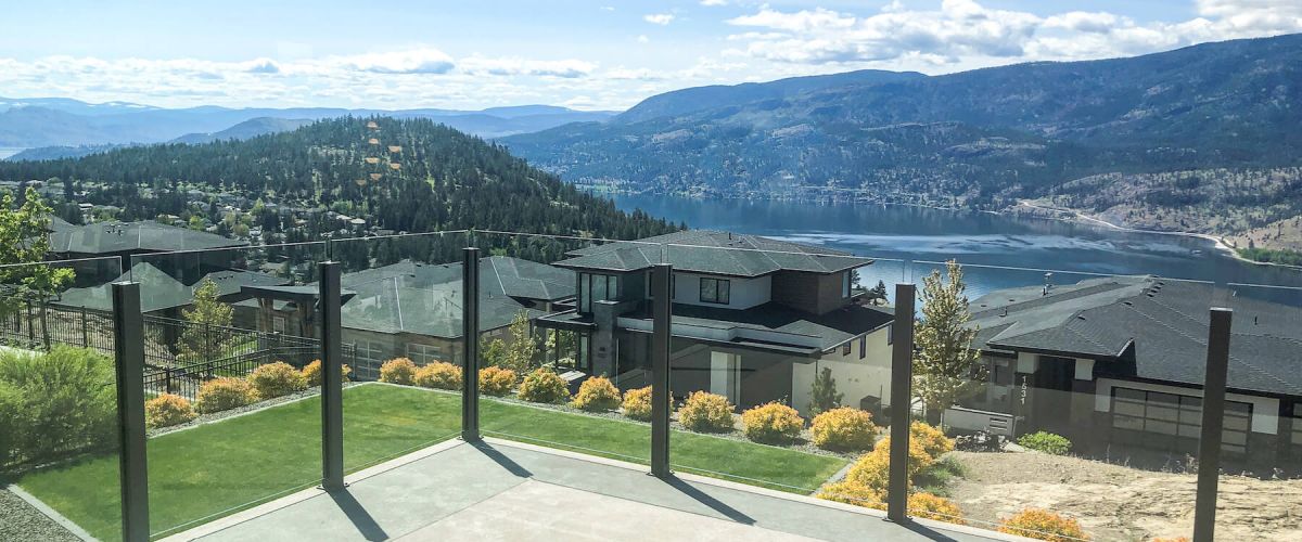 Frameless glass railing kit in Wilden, topless style with black posts