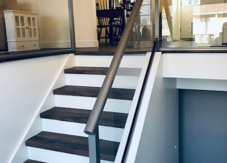 DekSmart Interior glass railing system inside a modern house.