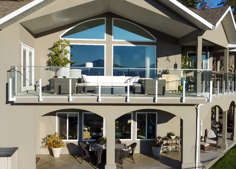 10mm engineered glass railing by DekSmart w/ white fascia mounts.