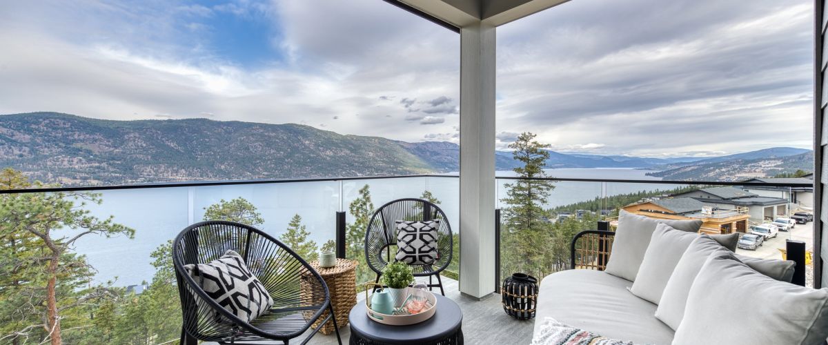 View of Okanagan Lake from deck w/ 10mm Glass railing by DekSmart.