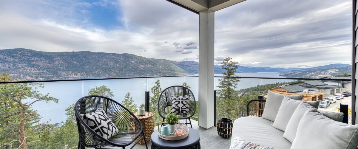 View of Okanagan Lake from a homeowner's deck with 10mm Glass railing by DekSmart Railings