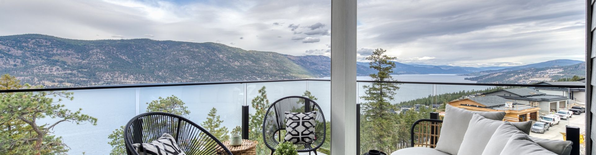 View of Okanagan Lake from deck w/ 10mm Glass railing by DekSmart.