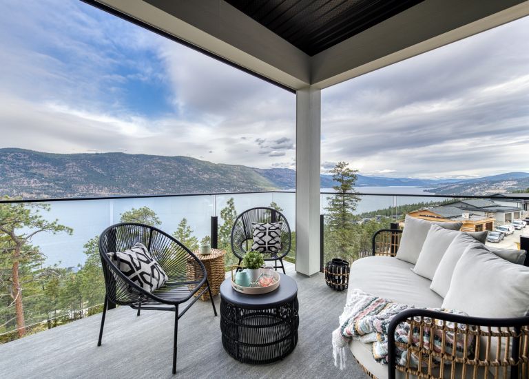 View of Okanagan Lake from deck w/ 10mm Glass railing by DekSmart.