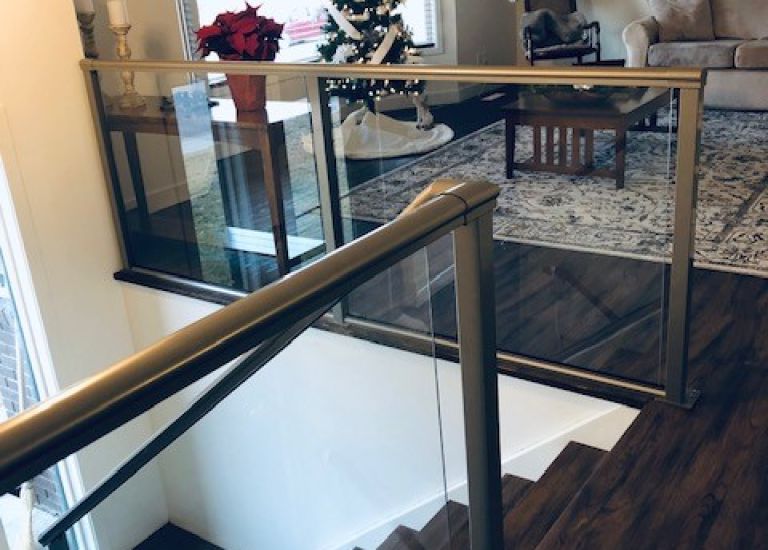 DekSmart interior glass railing (Royal Railing).
