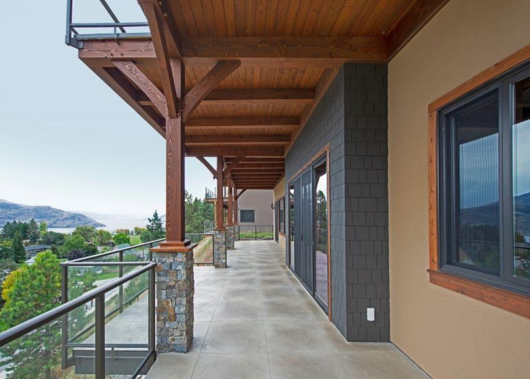 DekSmart Glass Railings with a black low profile top bar.