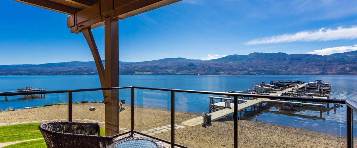 Black Glass Railing on a waterfront property on Barona Beach by Jane Hoffman