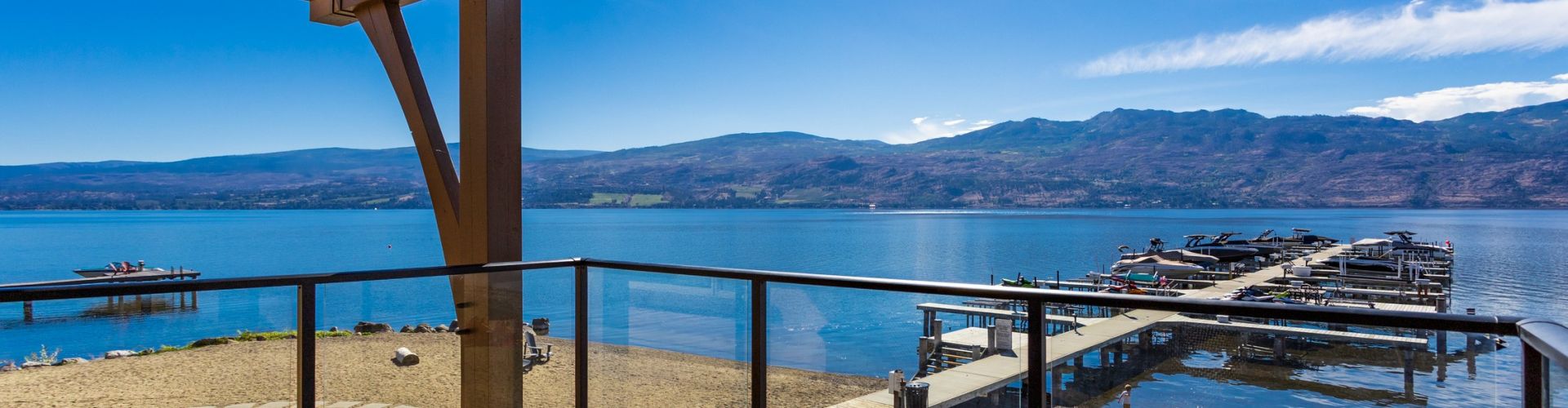 Black Glass Railing on a waterfront property on Barona Beach by Jane Hoffman