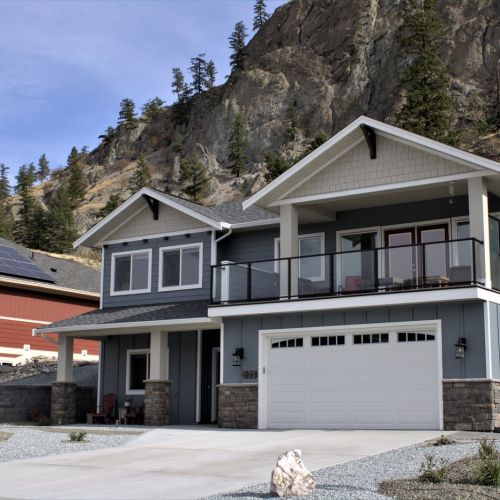DekSmart Glass Railing and Privacy Wall / Wind Wall for deck set up on a home's 2nd floor balcony