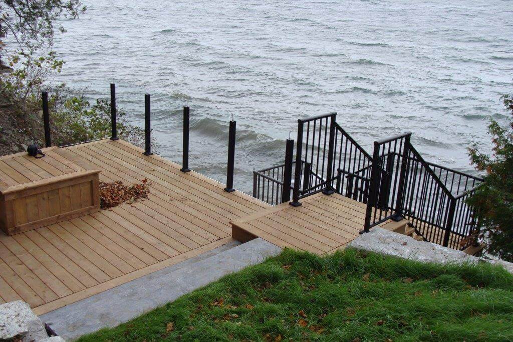 Combo glass and picket railing system installed in a waterfront home