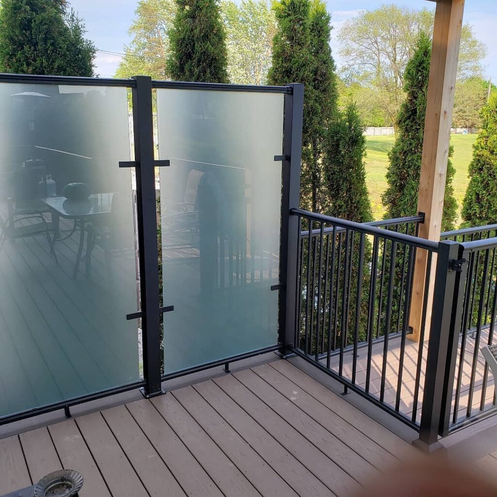 Glass privacy wall and picket railing with frosted glass